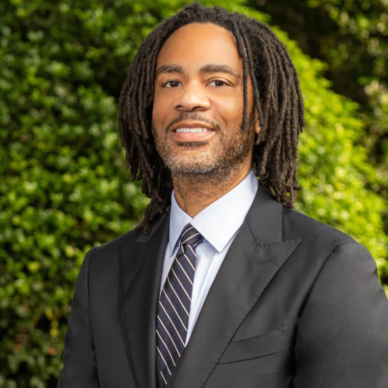 Kyle Samuels, HR Expert, and CEO & Founder of Creative Talent Endeavors, seen posing for a photo in grey color suit